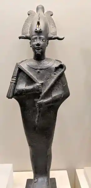 Ancient Egyptian copper alloy statuette of Osiris with gold inlay atef crown, crook and flail